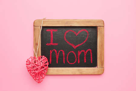 Chalkboard with text I LOVE MOM on color backgroundの写真素材