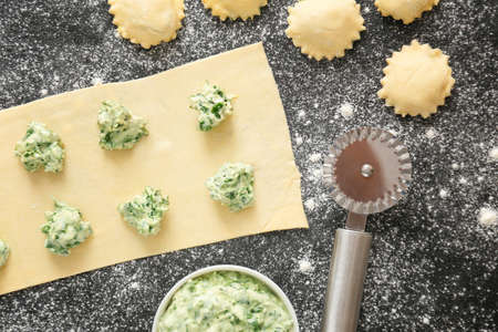 Preparing of tasty ravioli on dark backgroundの写真素材