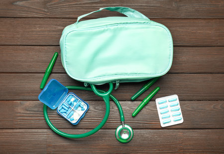 First aid kit on wooden backgroundの写真素材