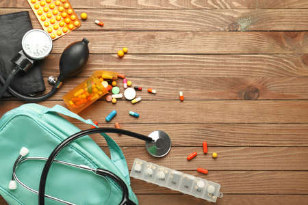 First aid kit on wooden backgroundの写真素材