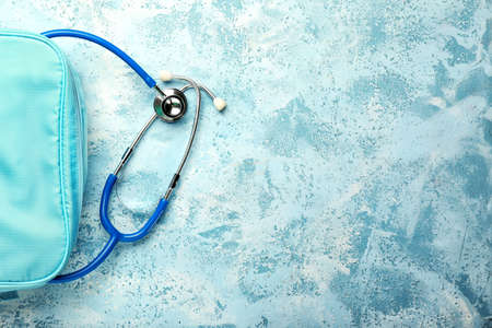 Stethoscope with bag on color backgroundの写真素材