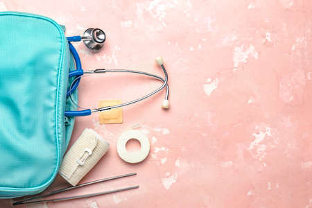 First aid kit on color backgroundの写真素材