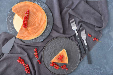 Tasty cheesecake with berries on dark backgroundの写真素材