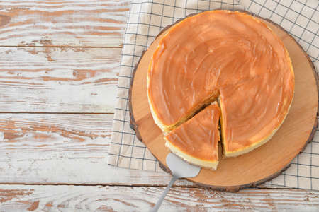 Tasty cheesecake on wooden tableの写真素材