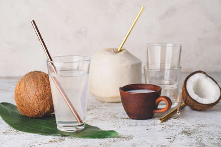 Composition with fresh coconut water on tableの写真素材