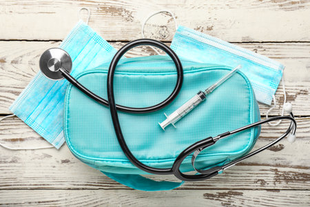 First aid kit on white wooden backgroundの写真素材