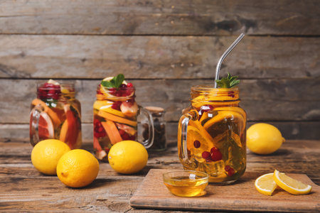 Mason jar of cold tea on wooden tableの写真素材