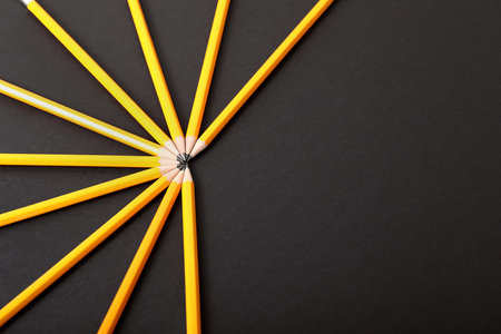 Many pencils on dark backgroundの写真素材