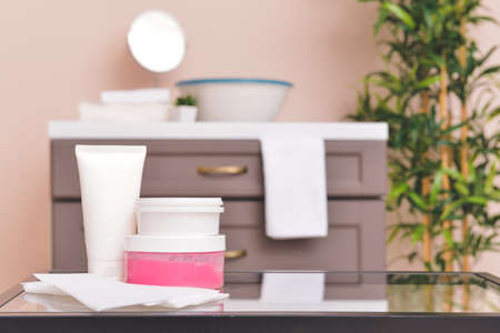 Sugaring paste for hair removal with cosmetics in bathroomの写真素材