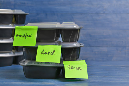 Containers with healthy food on wooden backgroundの写真素材