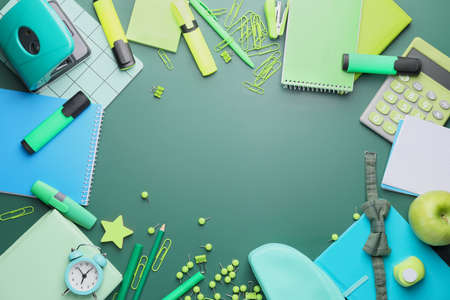 Set of school stationery on green backgroundの写真素材