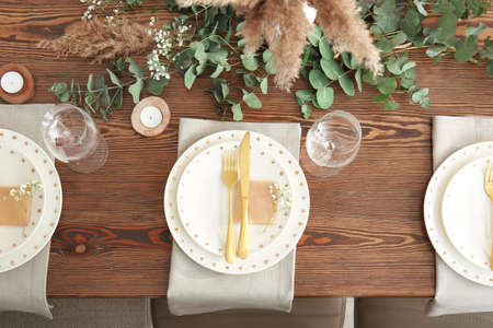Beautiful table setting for wedding celebration in restaurantの写真素材