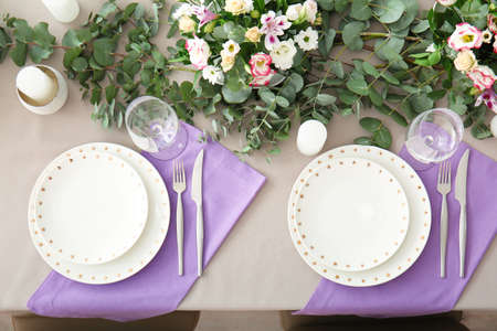 Beautiful table setting for wedding celebration in restaurantの写真素材