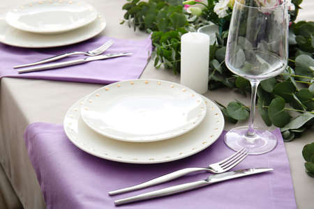 Beautiful table setting for wedding celebration in restaurantの写真素材
