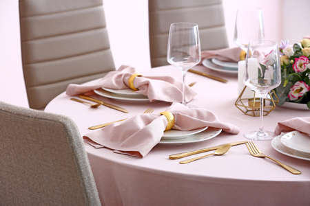 Beautiful table setting for wedding celebration in restaurantの写真素材