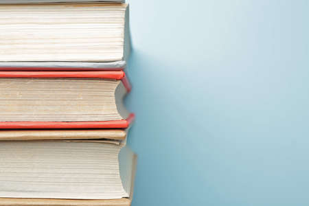 Three books on color background, closeupの写真素材