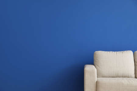 Modern sofa near color wallの写真素材