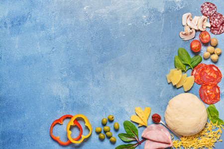 Ingredients for tasty pizza on color backgroundの写真素材