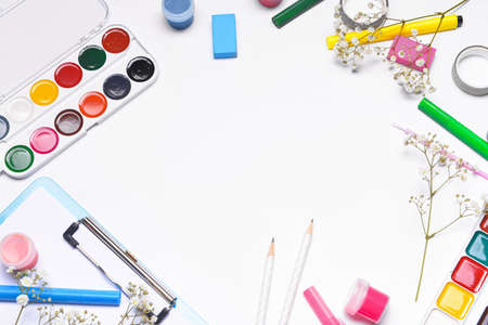 Frame made of school supplies on white backgroundの写真素材