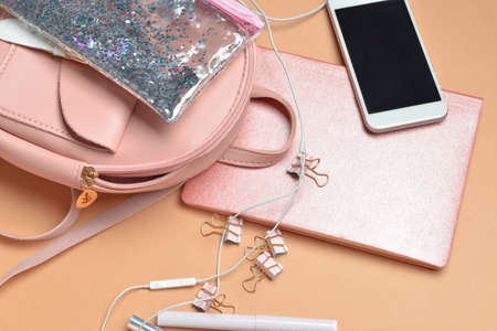 Set of school supplies with backpack and mobile phone on color backgroundの写真素材