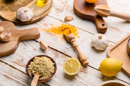 Ingredients for honey mustard sauce on white wooden backgroundの写真素材