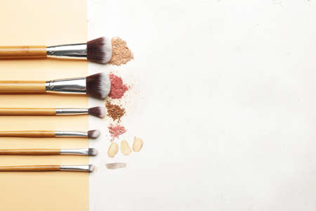 Set of makeup brushes and cosmetics on light backgroundの写真素材