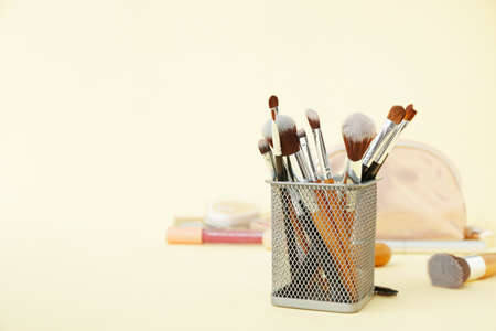 Set of makeup brushes on color backgroundの写真素材