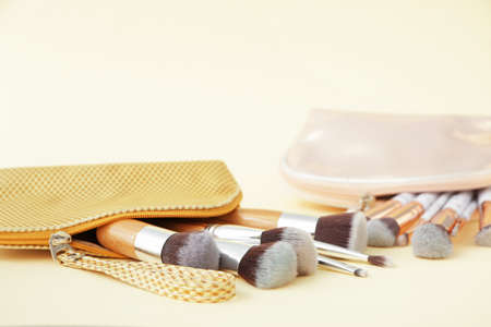 Set of makeup brushes on color backgroundの写真素材