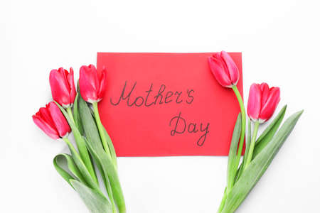Beautiful flowers and card for Mother's Day on white backgroundの写真素材