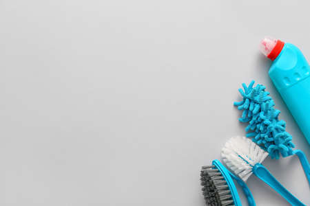 Set of cleaning supplies on light background