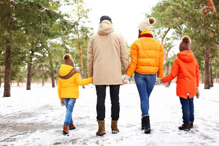 Happy family in park on winter day