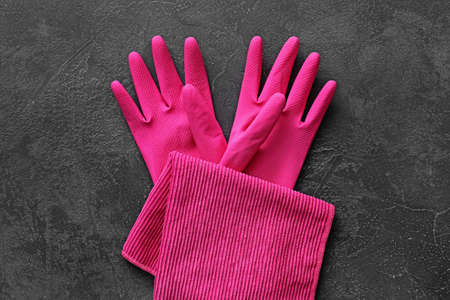 Rubber gloves and napkin on dark backgroundの写真素材