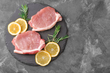 Raw pork meat on dark backgroundの写真素材