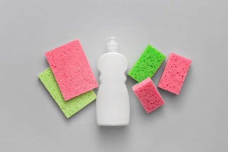 Set of cleaning supplies on light backgroundの写真素材
