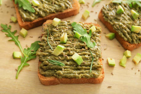 Tasty avocado sandwiches on board closeupの写真素材