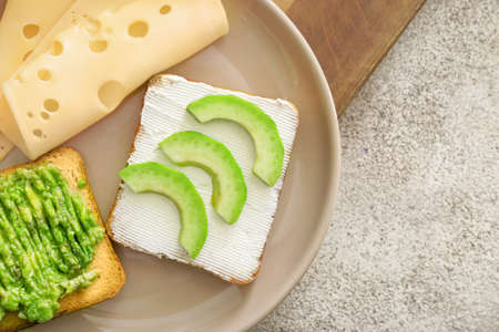 Tasty avocado sandwiches on plateの写真素材