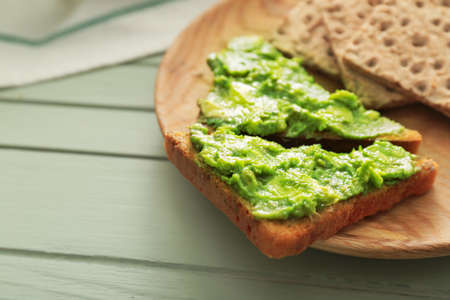 Plate with tasty avocado sandwiches on tableの写真素材