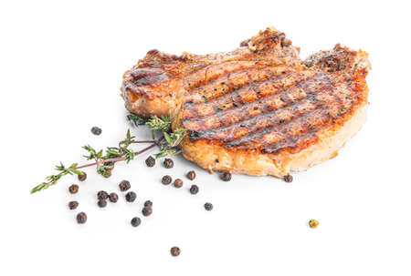 Cooked pork steak with spices on white backgroundの写真素材