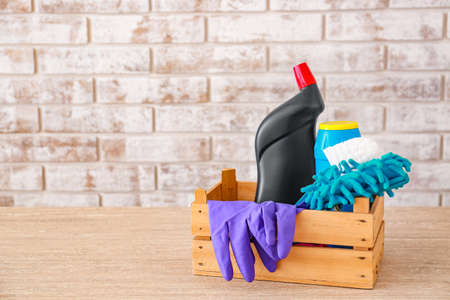Set of cleaning supplies on tableの写真素材