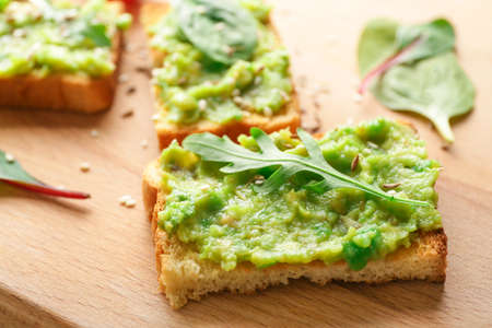 Tasty avocado sandwiches on board closeupの写真素材