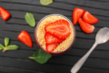 Glass with tasty panna cotta on tableの写真素材