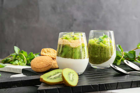 Glasses with tasty panna cotta on tableの写真素材