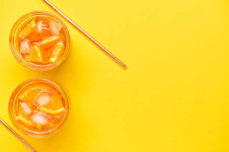 Glasses of tasty cold ice tea on color backgroundの写真素材