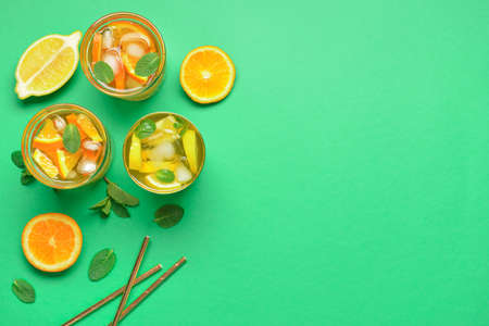 Glasses of tasty cold ice tea on color backgroundの写真素材