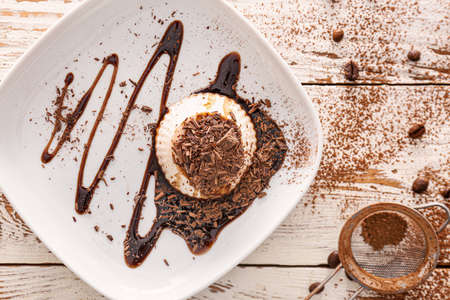 Plate with tasty panna cotta on tableの写真素材