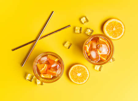 Glasses of tasty cold ice tea on color backgroundの写真素材