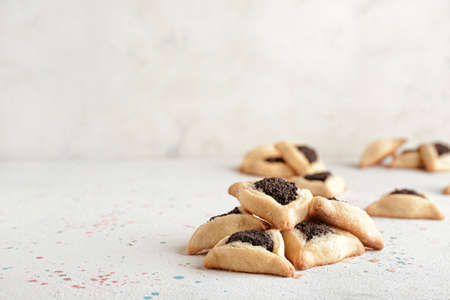 Tasty hamantaschen for Purim holiday on white backgroundの写真素材