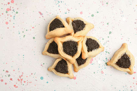Tasty hamantaschen for Purim holiday on white backgroundの写真素材