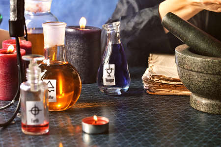 Bottles with potions on table of alchemistの写真素材
