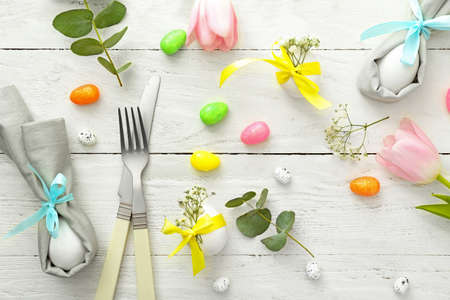 Beautiful Easter table setting on white wooden backgroundの写真素材